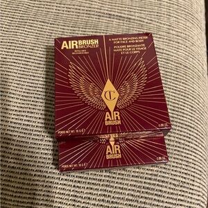 Charlotte Tilbury bronzer box in maroon and metallic gold